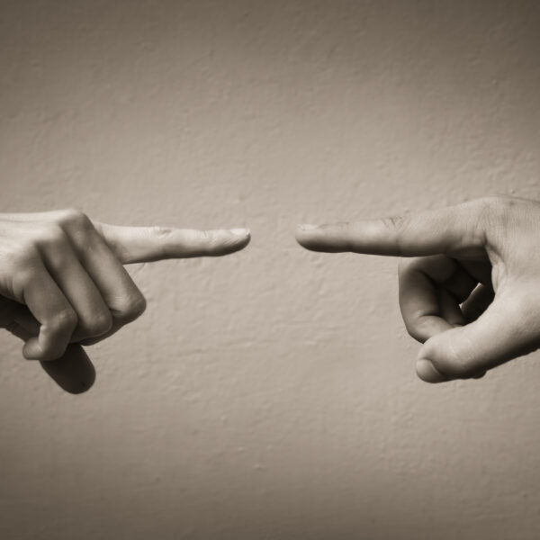 Fingers pointing at each other. People arguing and fighting conc